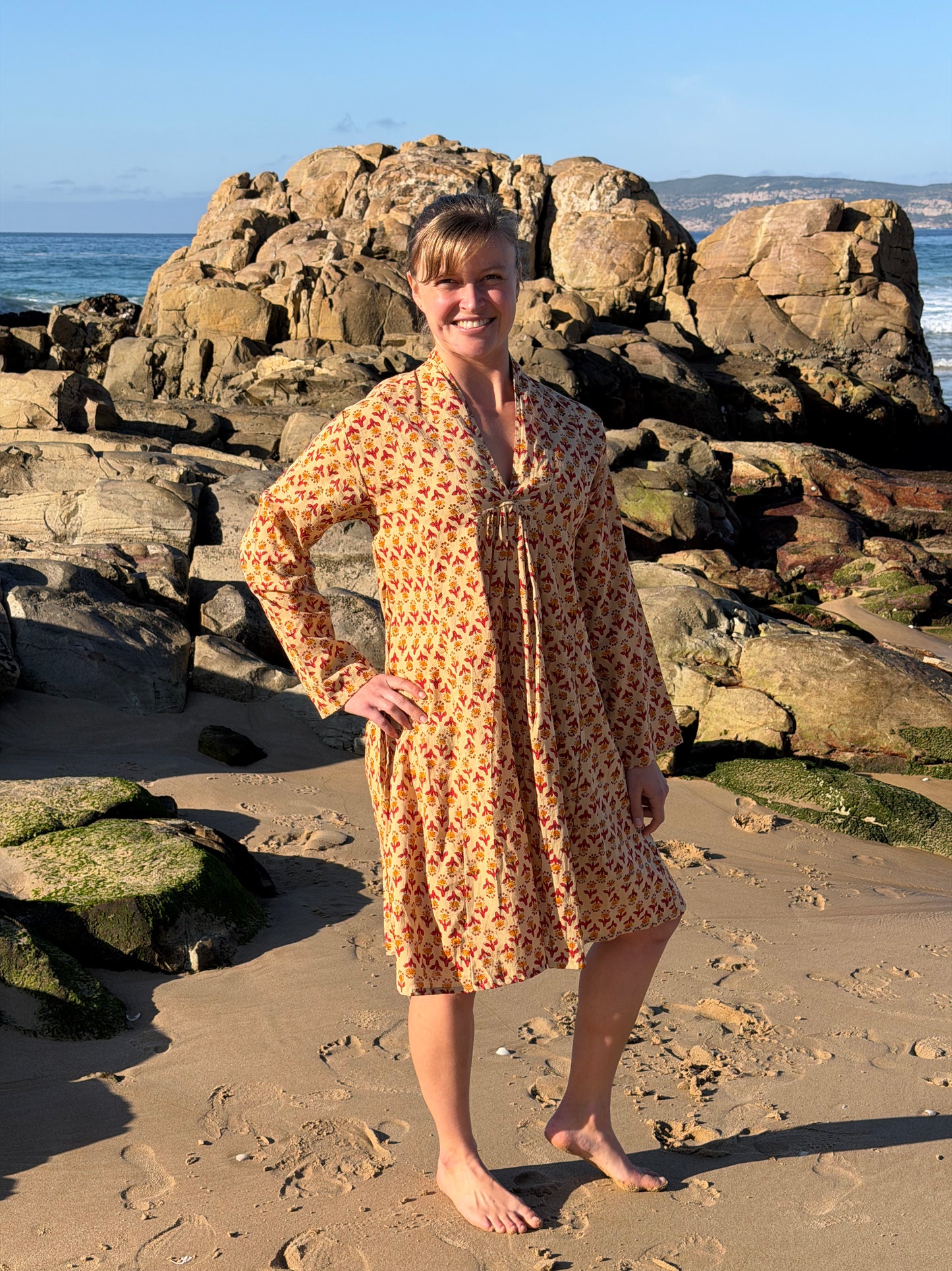 Beige dress with red & mustard pattern