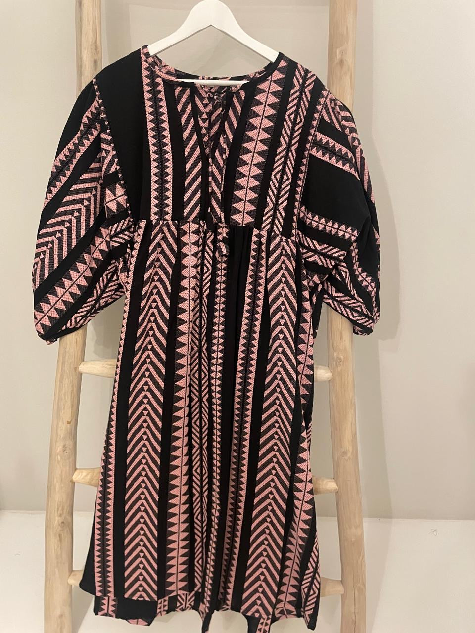 Black dress with pink fishbone geometric