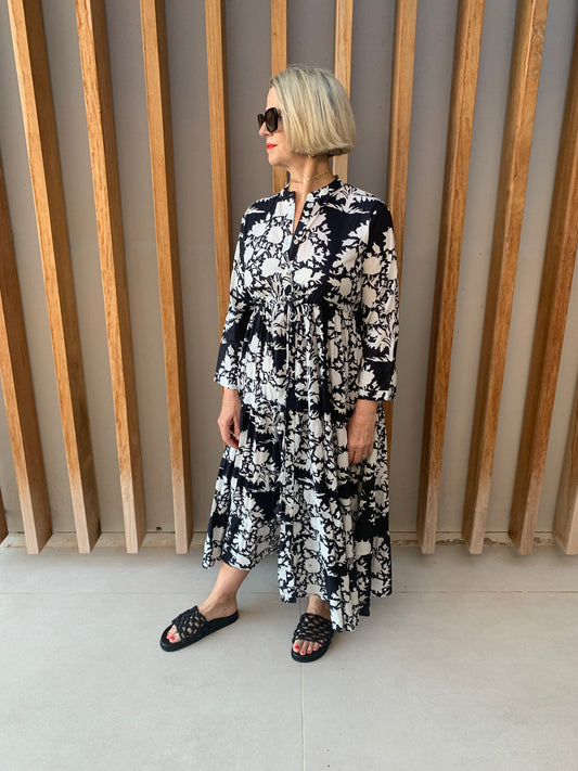 Black button-up dress with white floral pattern