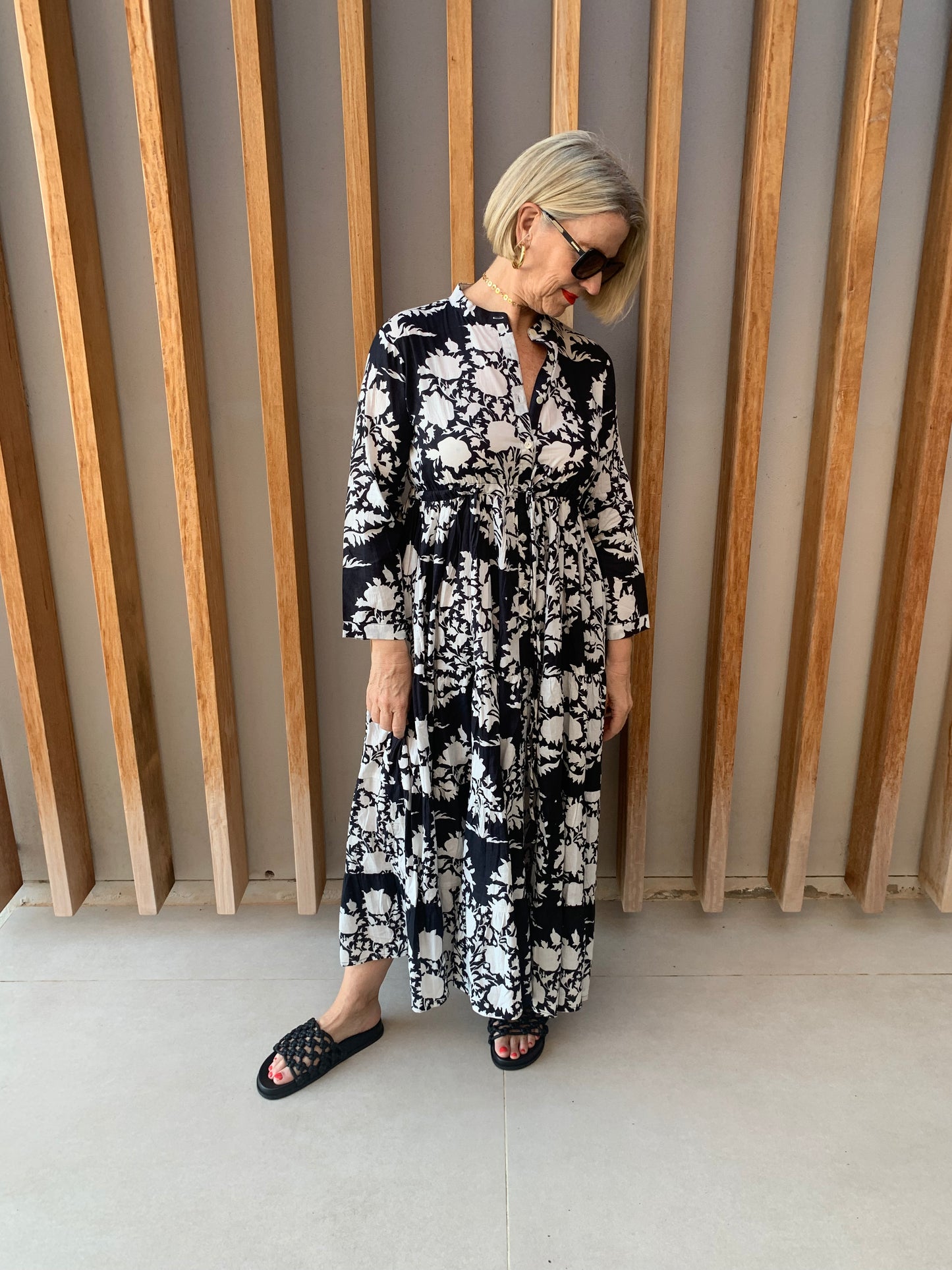 Black button-up dress with white floral pattern
