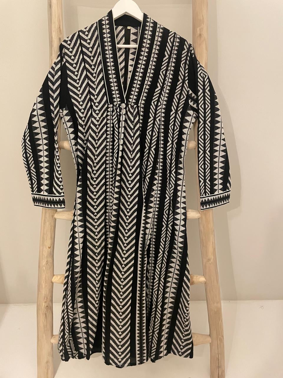 Black dress with white fishbone geometric design