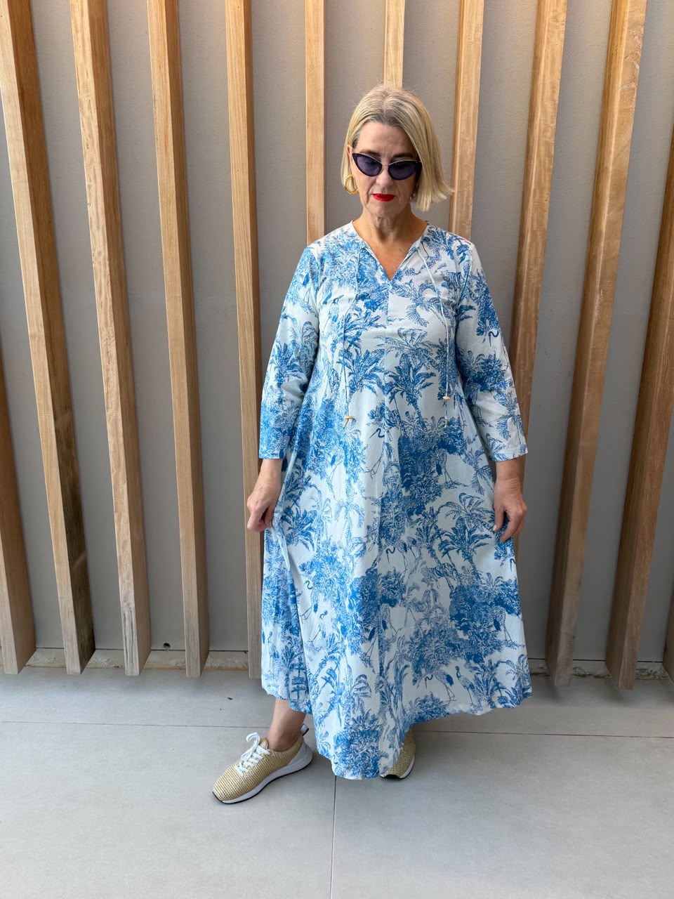 White dress with blue animal palm pattern