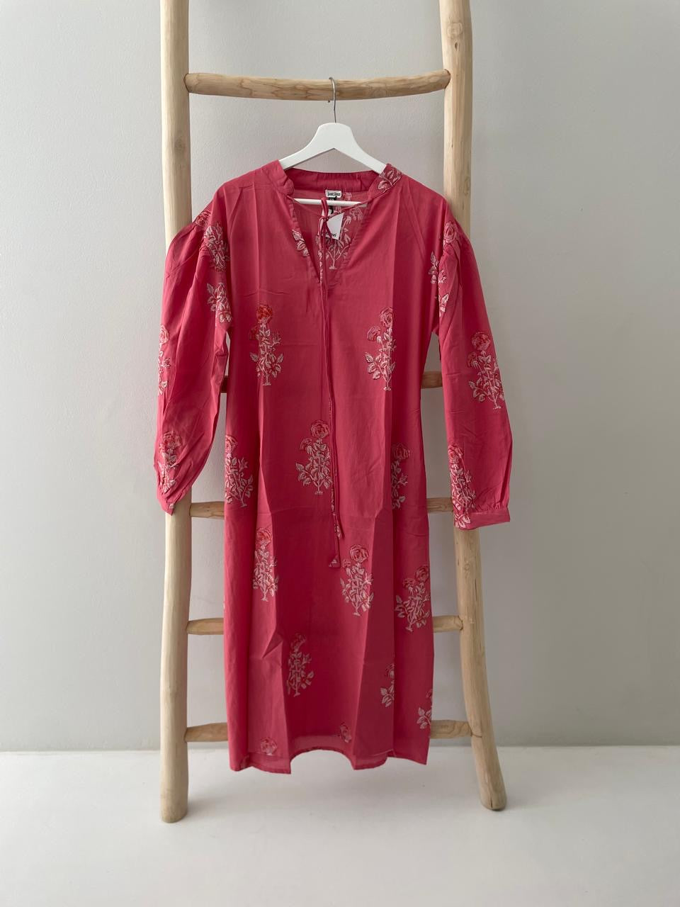 Deep pink dress with white floral pattern