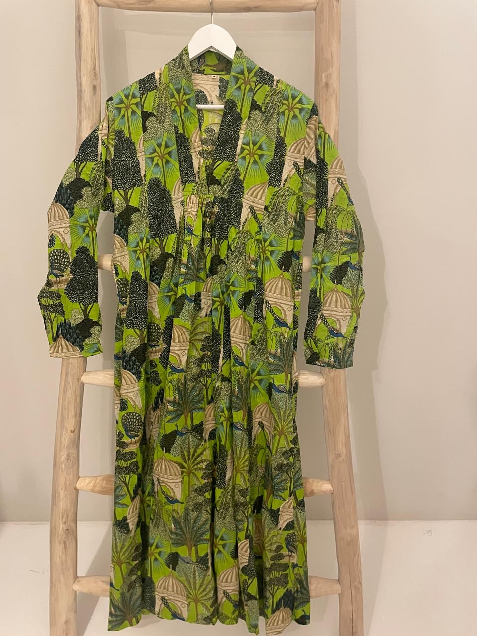 Green dress with bold forrest print