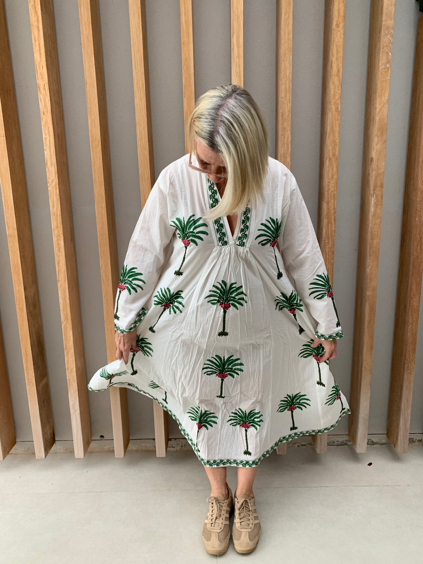 White dress with green palm pattern