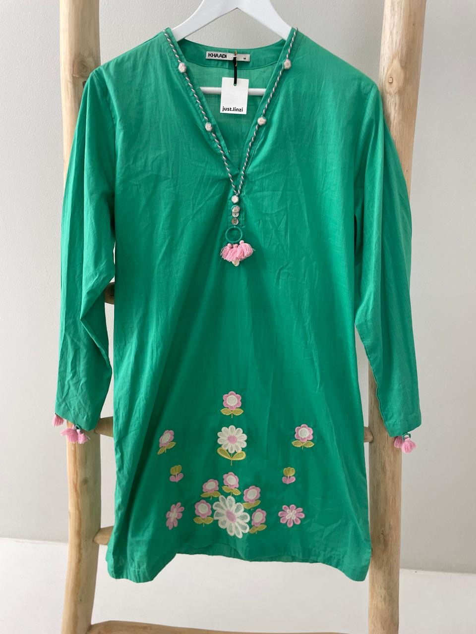 Green dress white floral embroidering