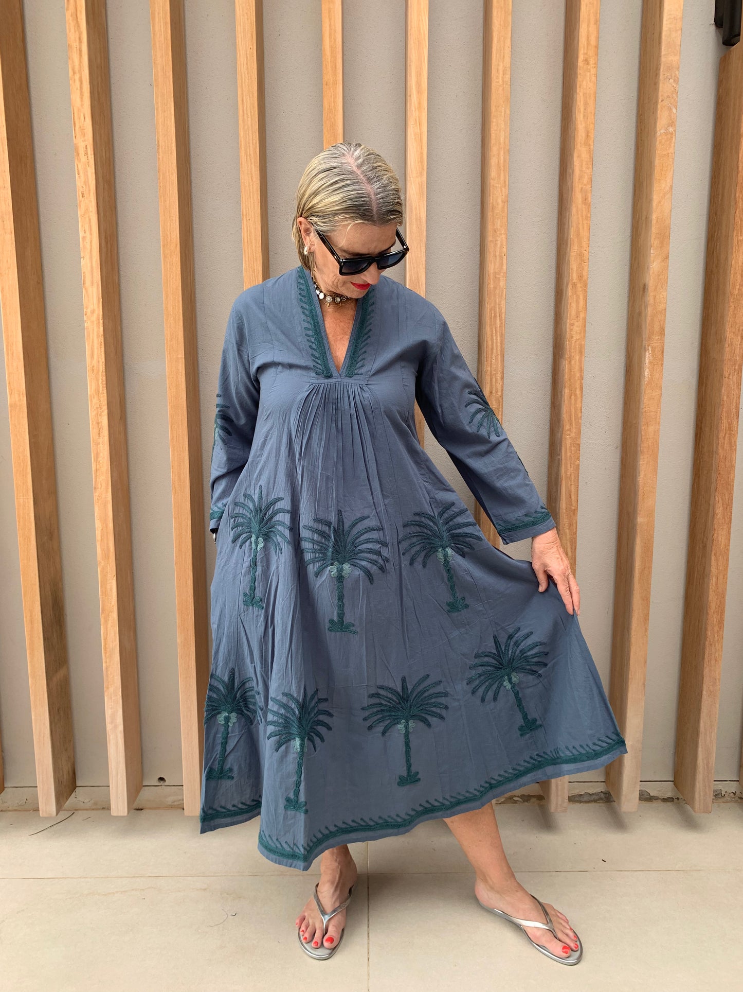 Grey dress with embroidered green palm pattern