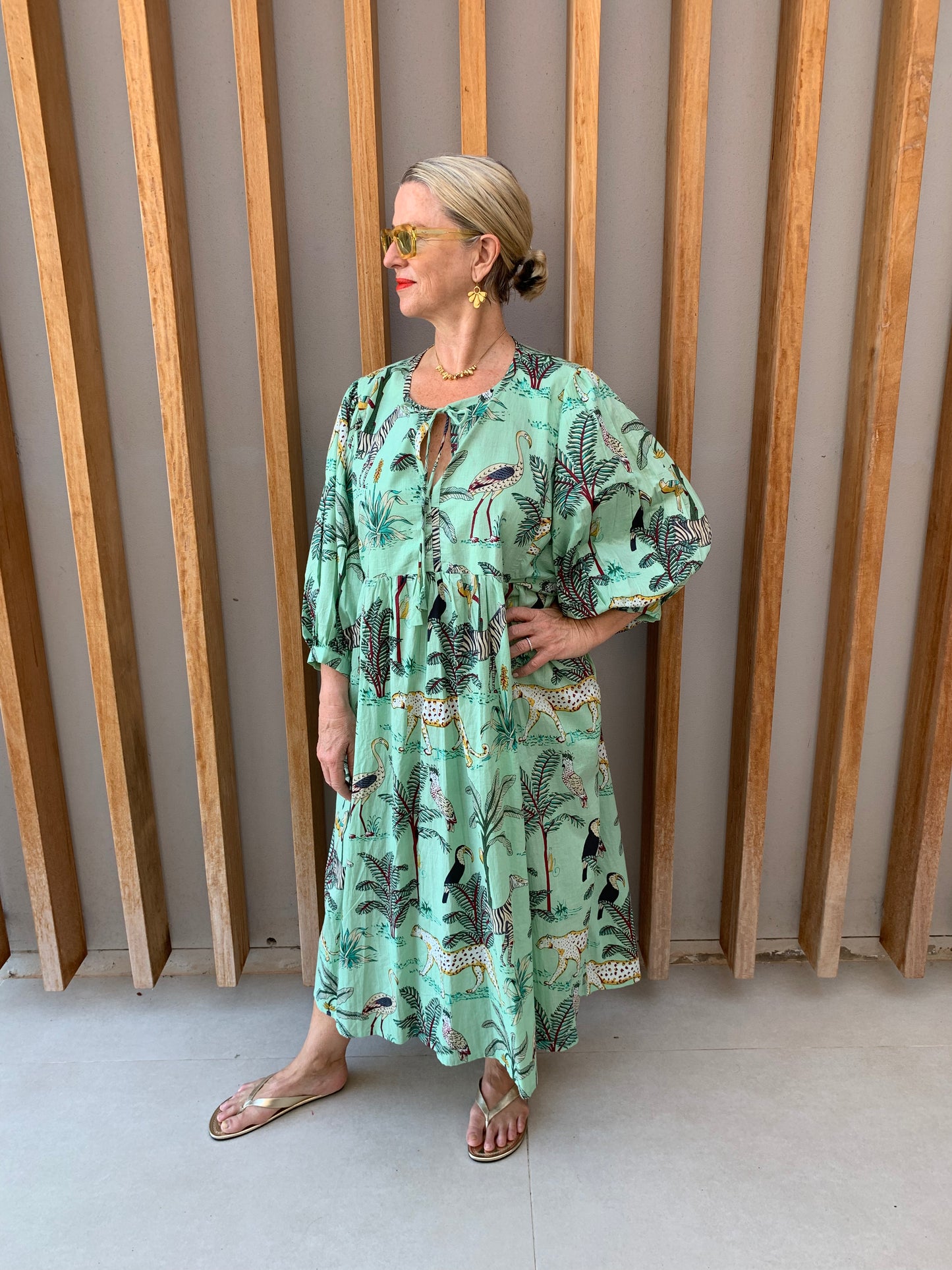 Pale green dress with jungle print pattern
