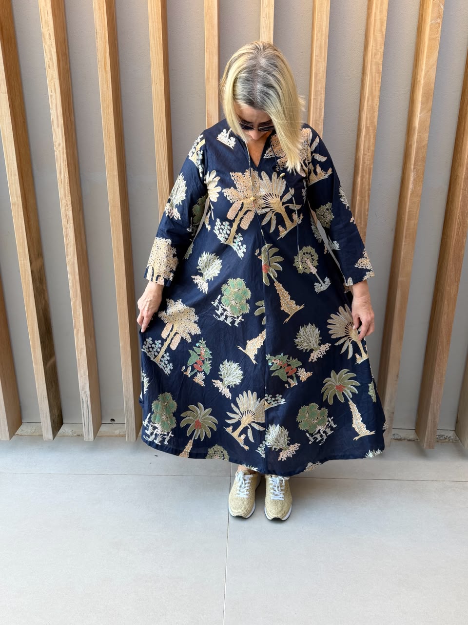 Navy dress with beige palm pattern