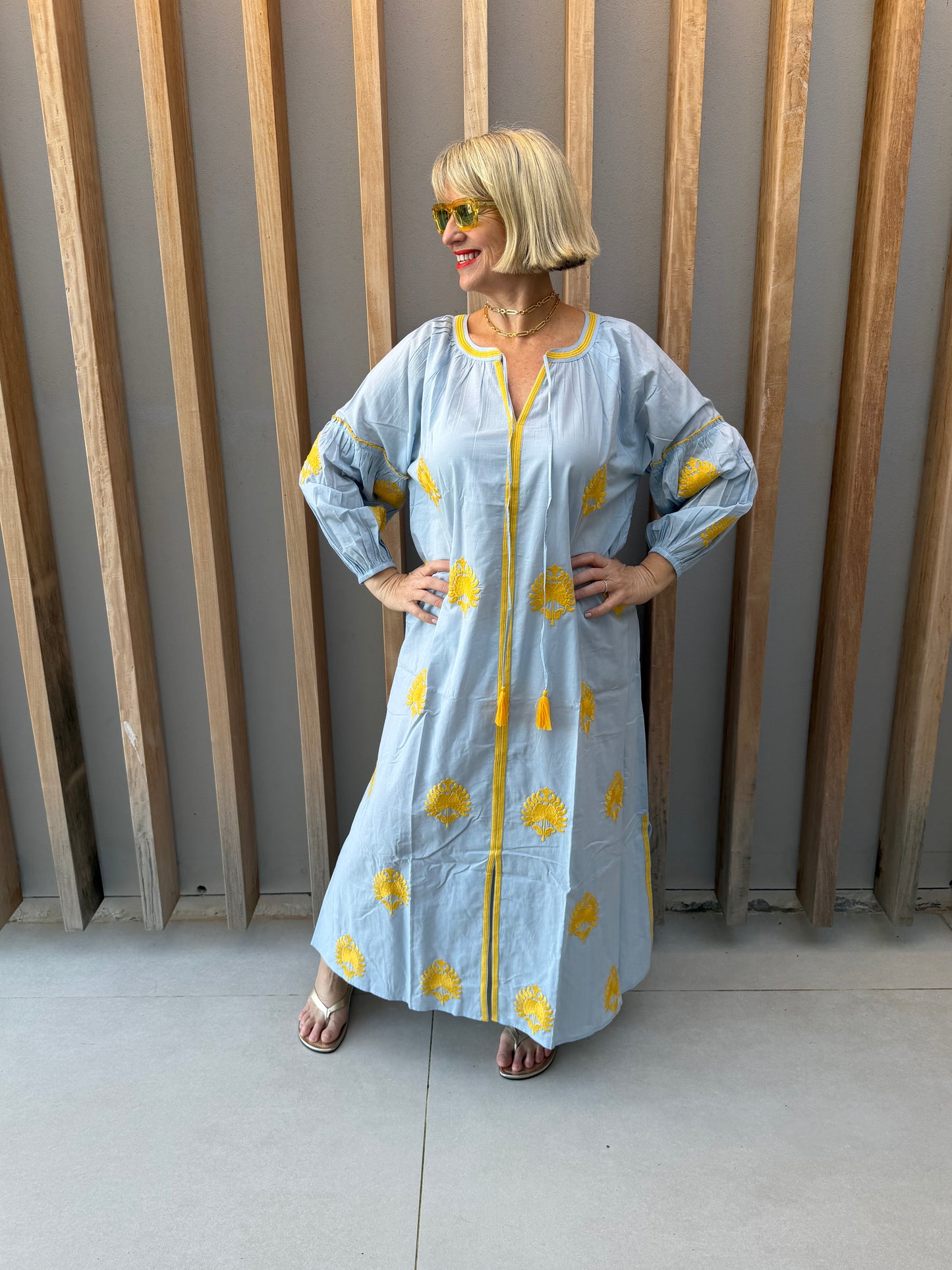 Pale blue dress with embroidered gold pattern