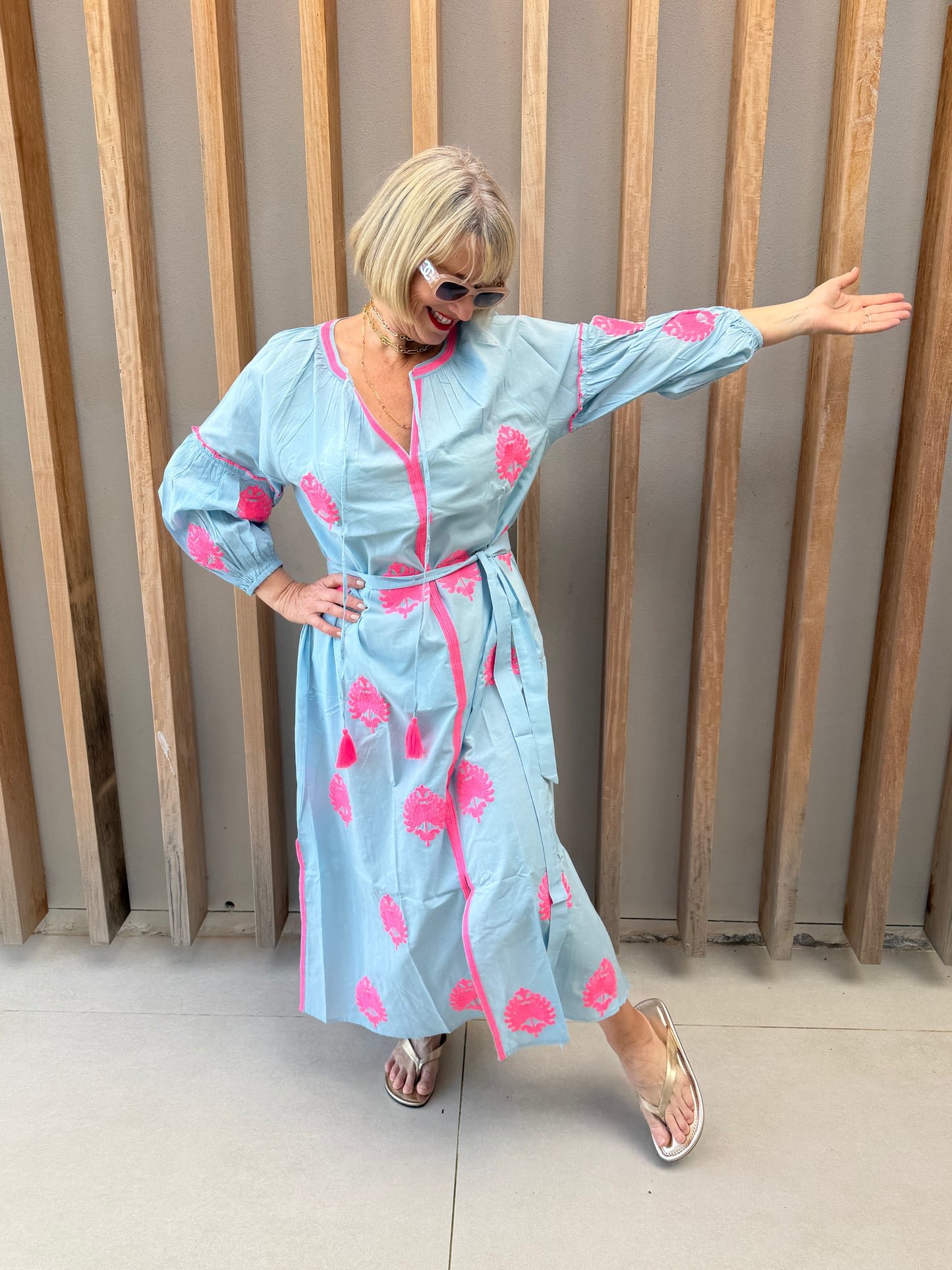 Pale blue dress with pink embroidered pattern