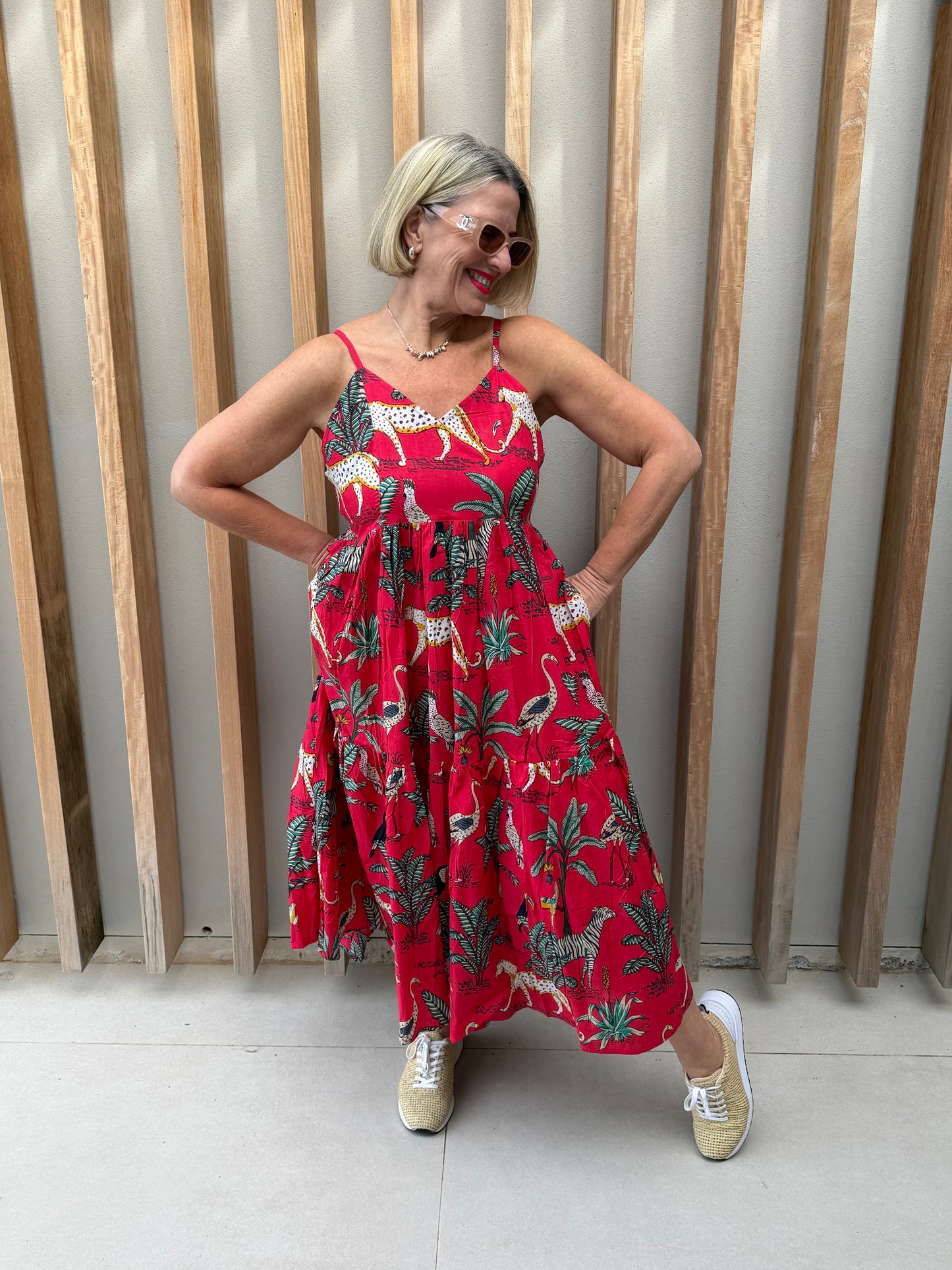 Red sleeveless dress with animal palm pattern