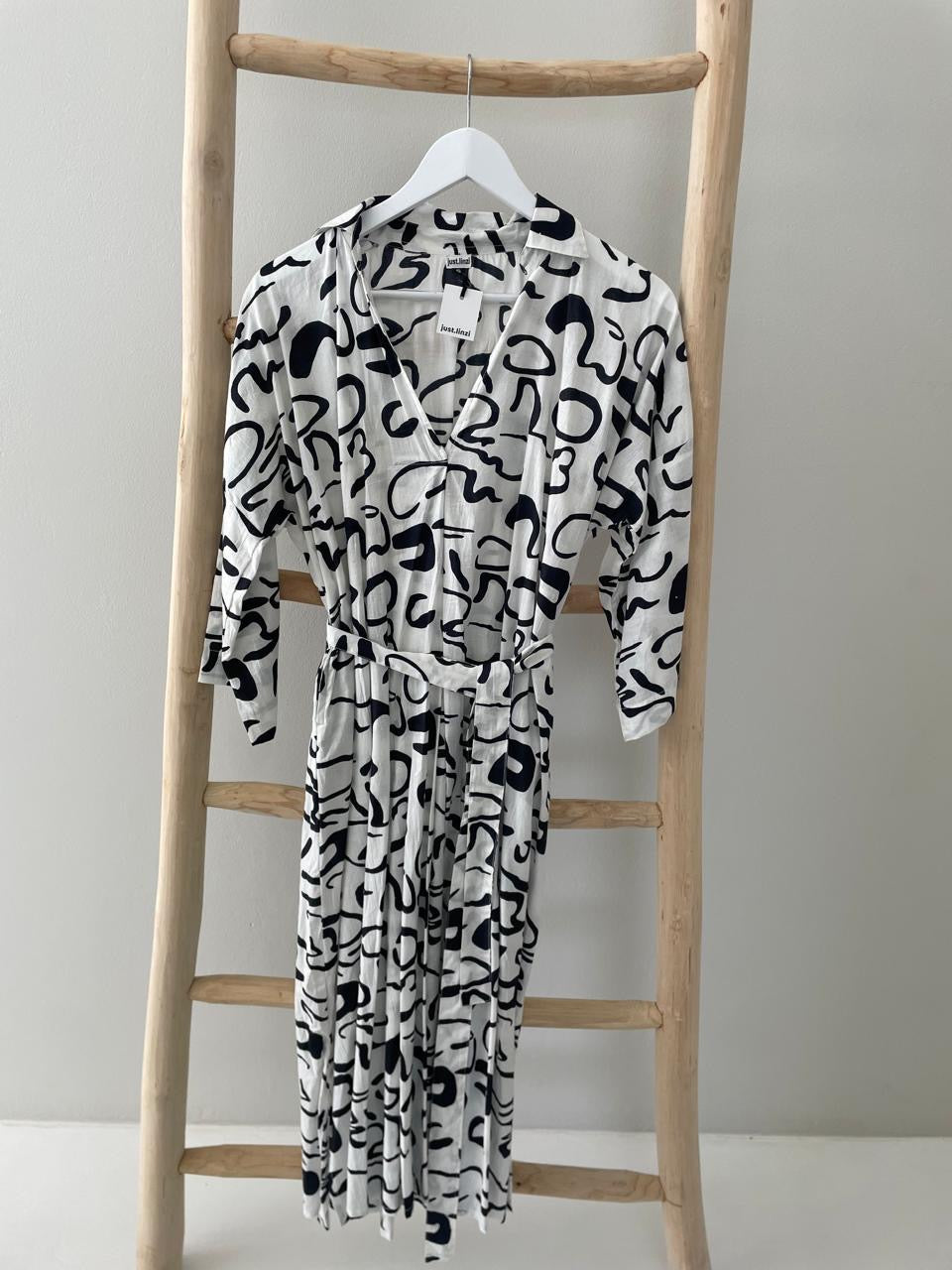 White dress with black pattern & collar