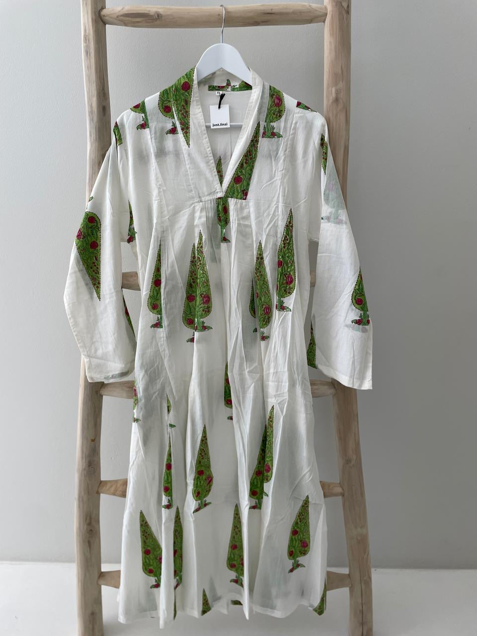 White dress with green conifer