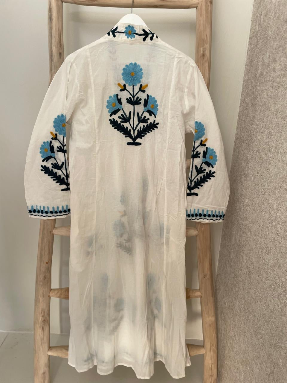 White dress with embroidered blue & green daisies