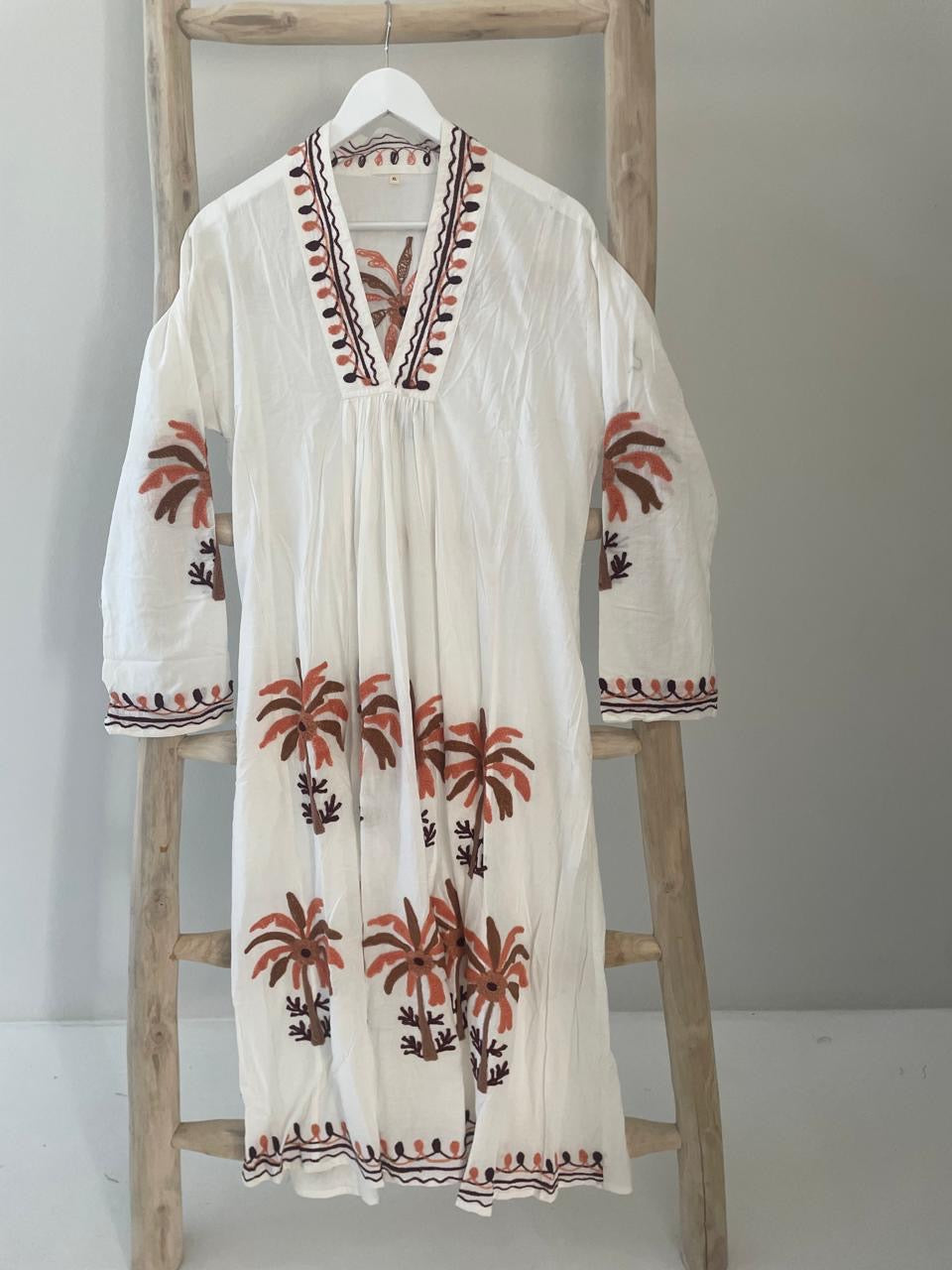 White dress with embroidered orange & brown palm