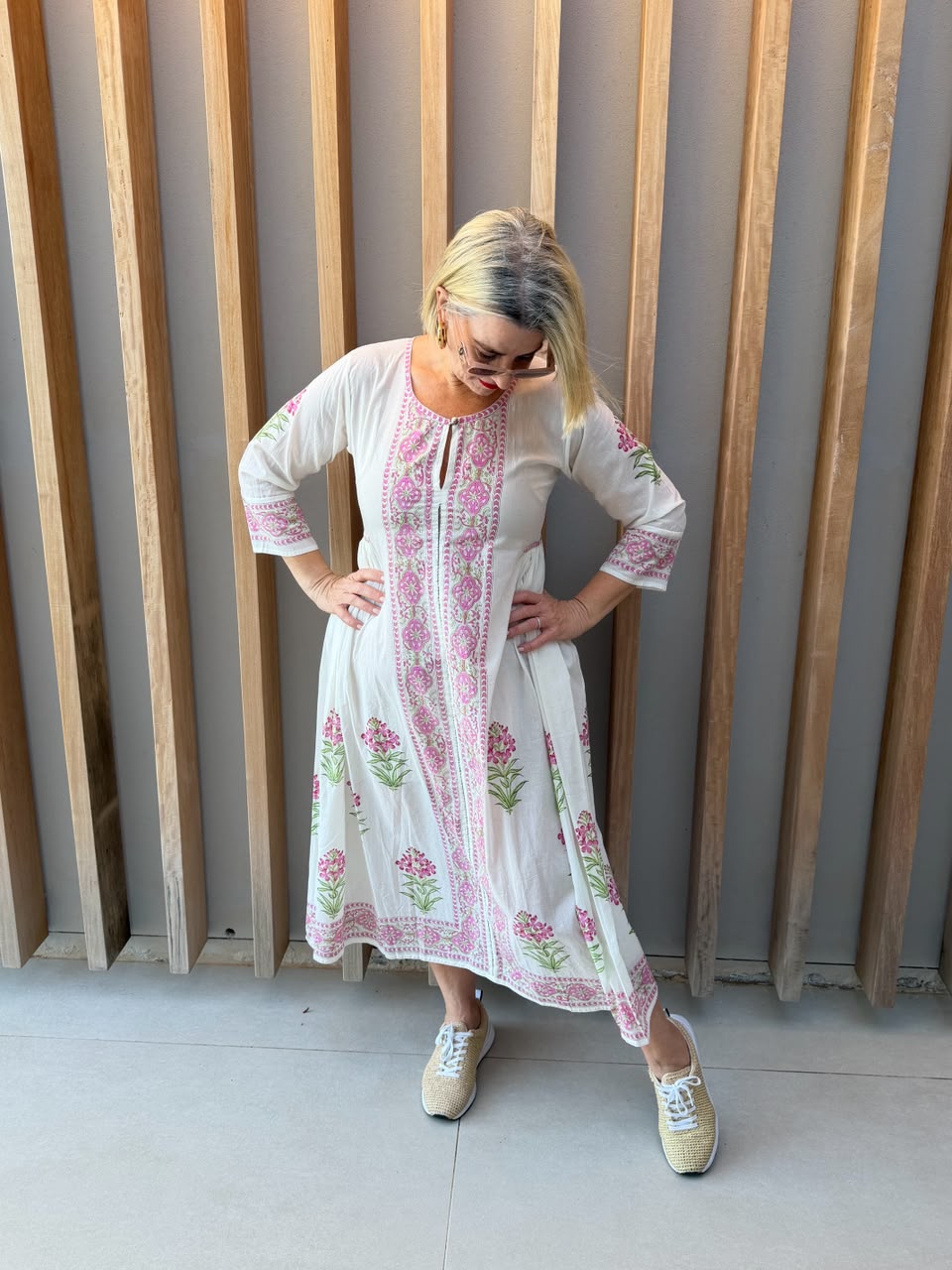 White dress with pink floral pattern
