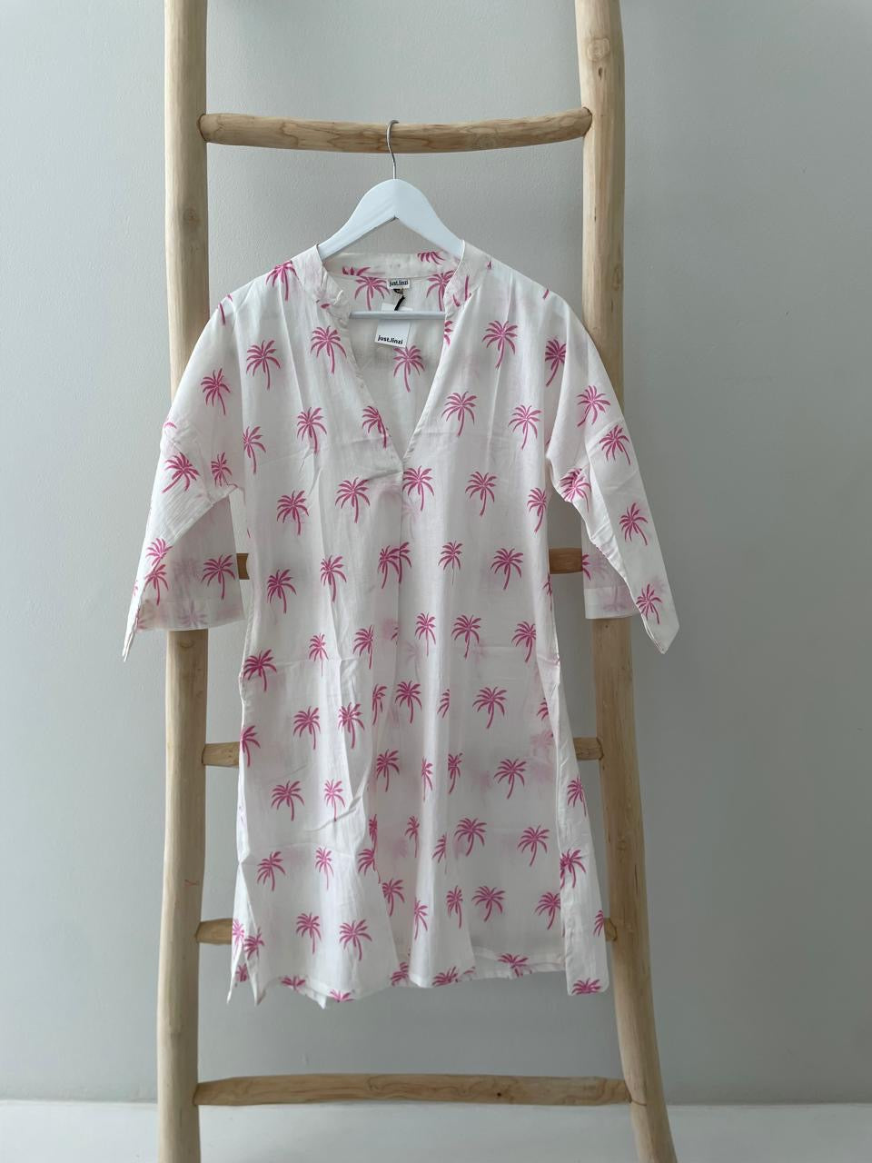 White dress with floral pink palm