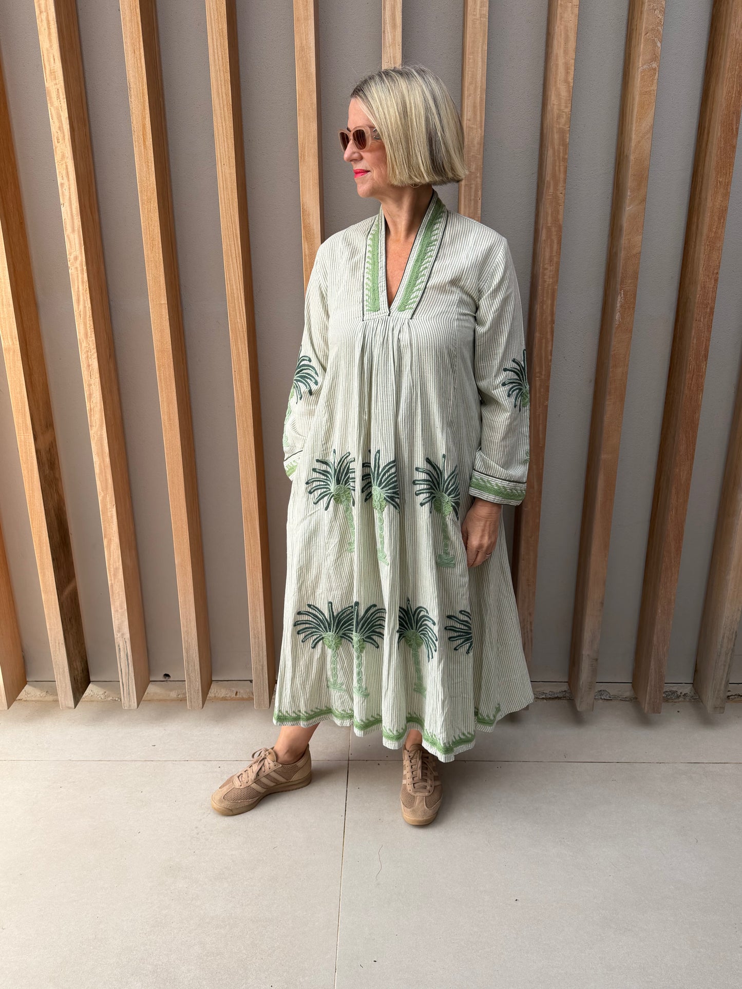 Apple green striped dress with embroidered palm