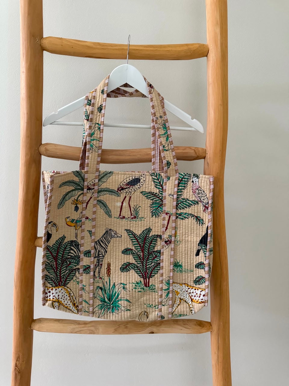 Beige tote bag with animal palm pattern