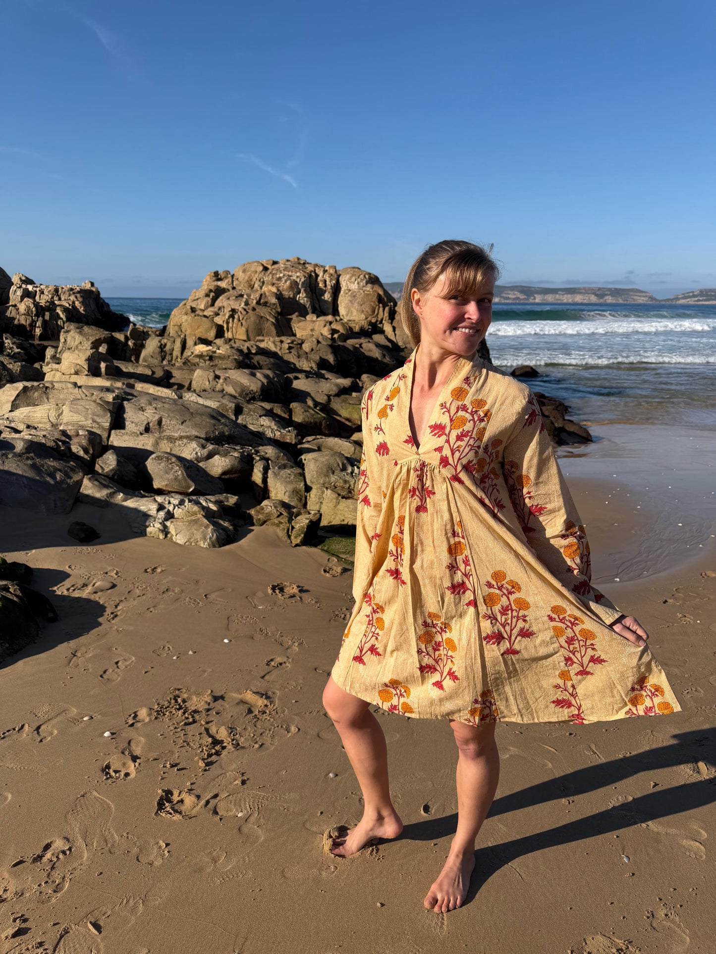 Beige dress with red & yellow floral pattern