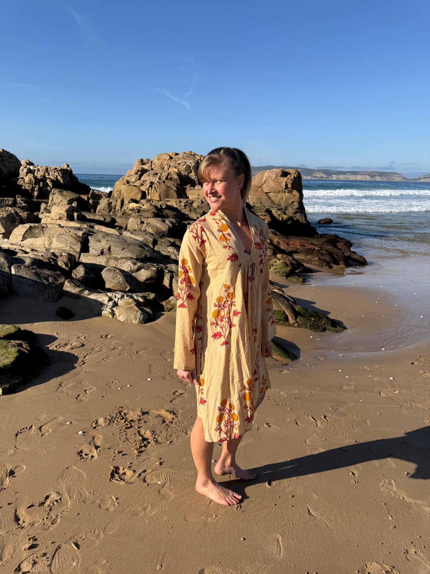 Beige dress with red & yellow floral pattern