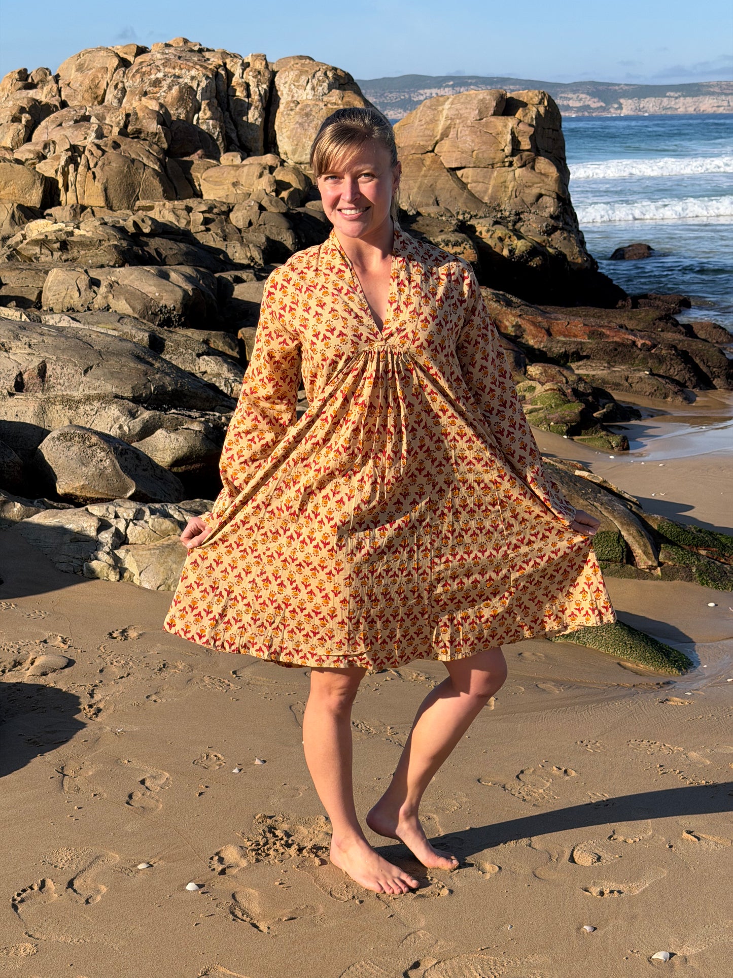 Beige dress with red & mustard pattern