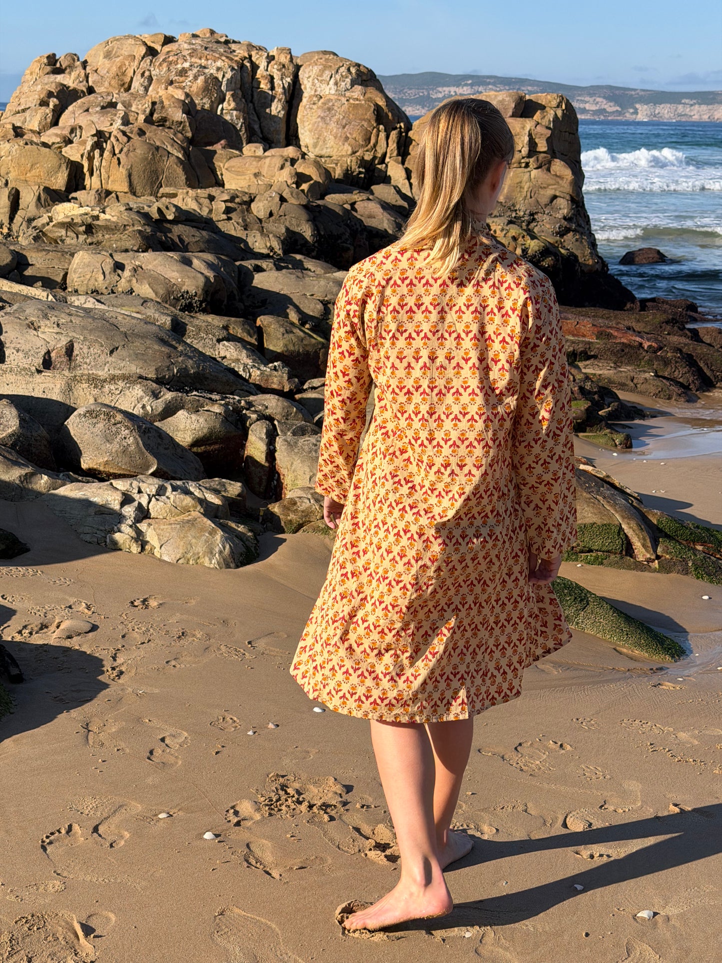 Beige dress with red & mustard pattern