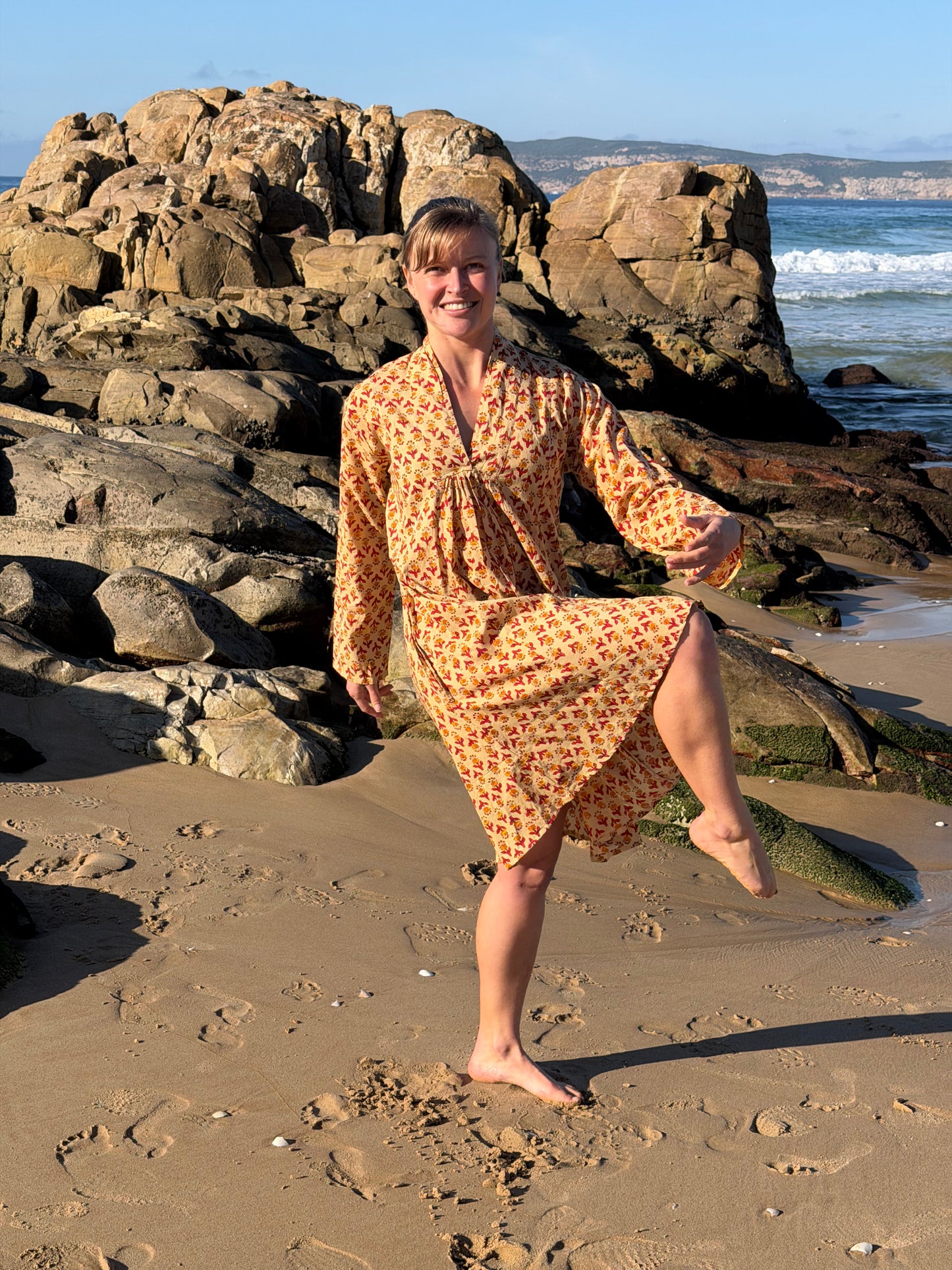 Beige dress with red & mustard pattern