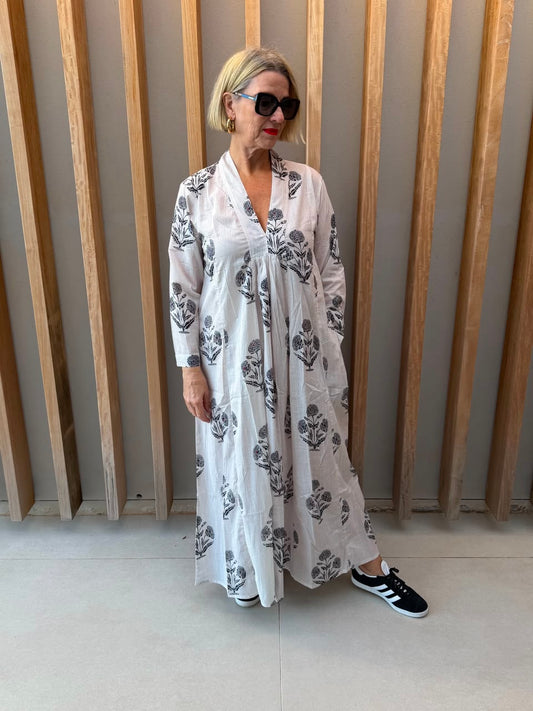 White dress with black daisy floral pattern
