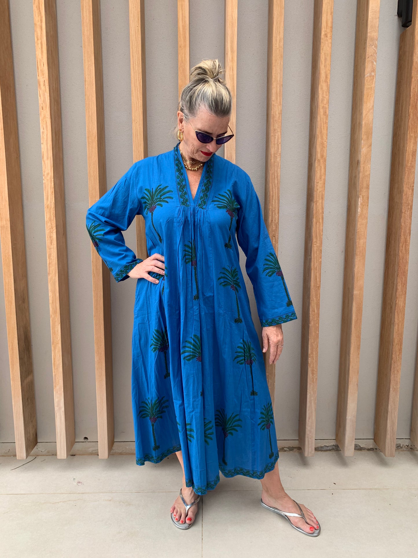 Blue dress with green palm pattern