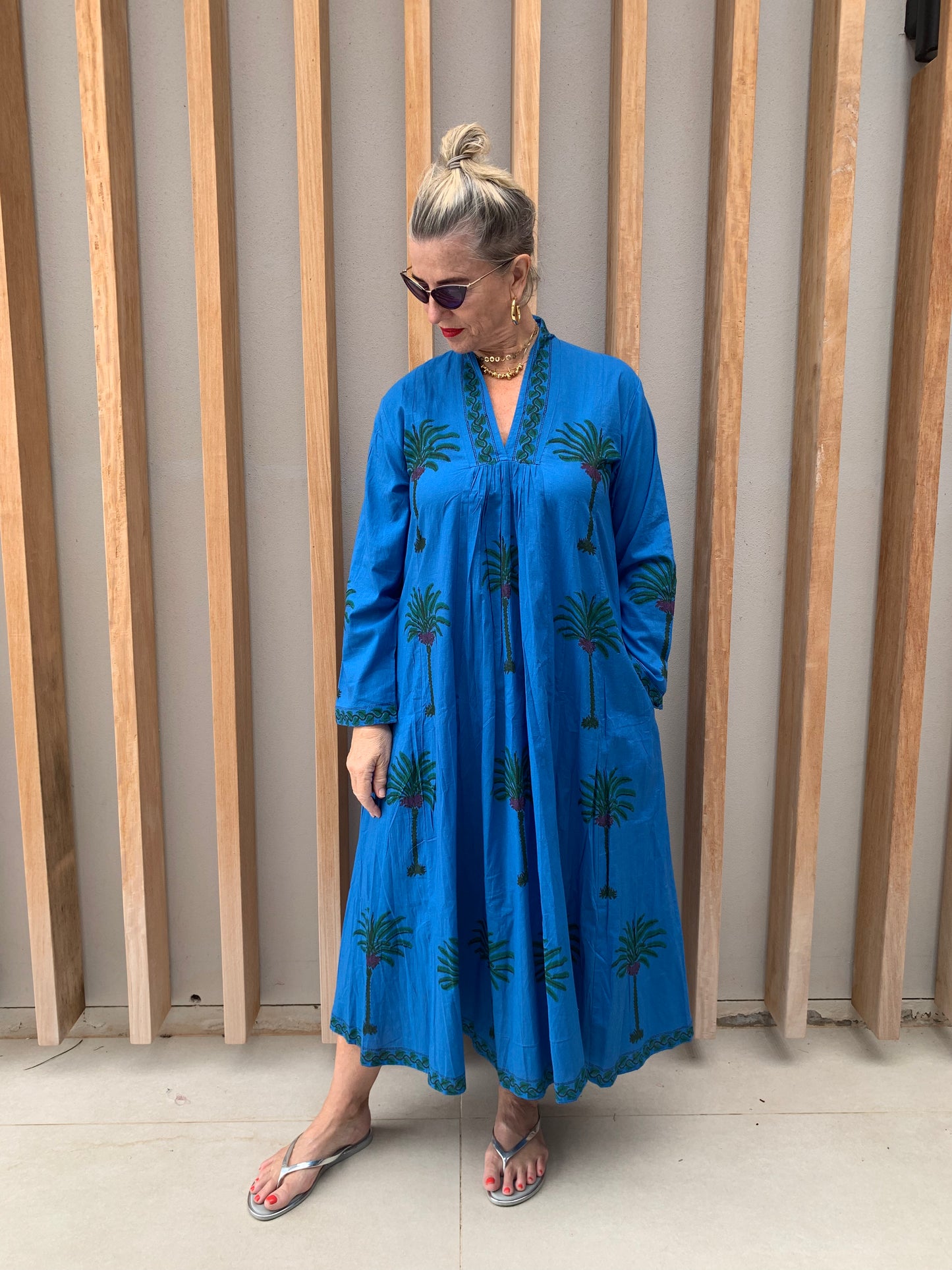 Blue dress with green palm pattern