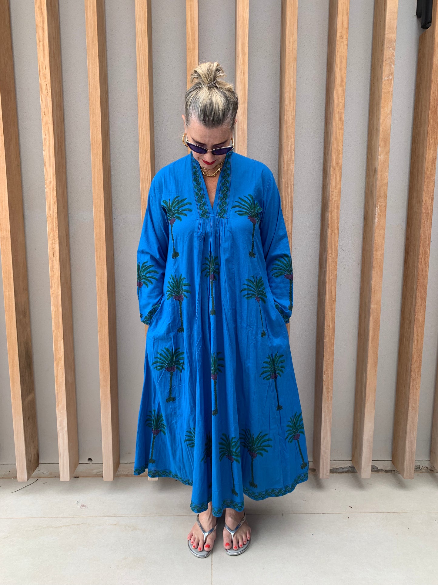 Blue dress with green palm pattern