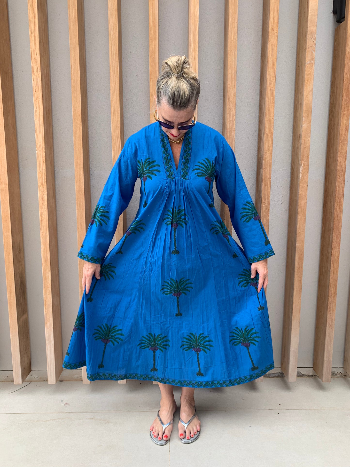 Blue dress with green palm pattern