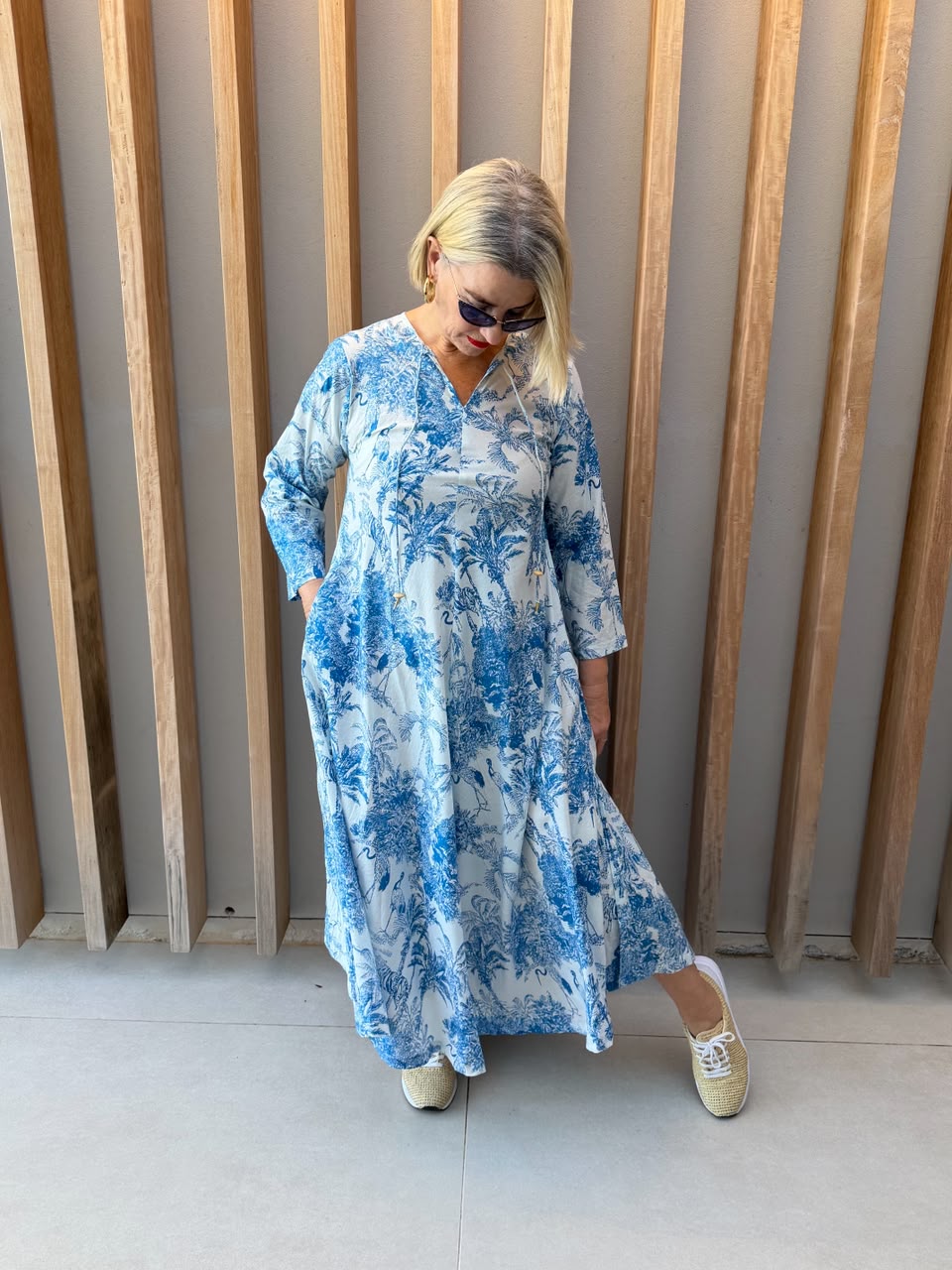White dress with blue animal palm pattern