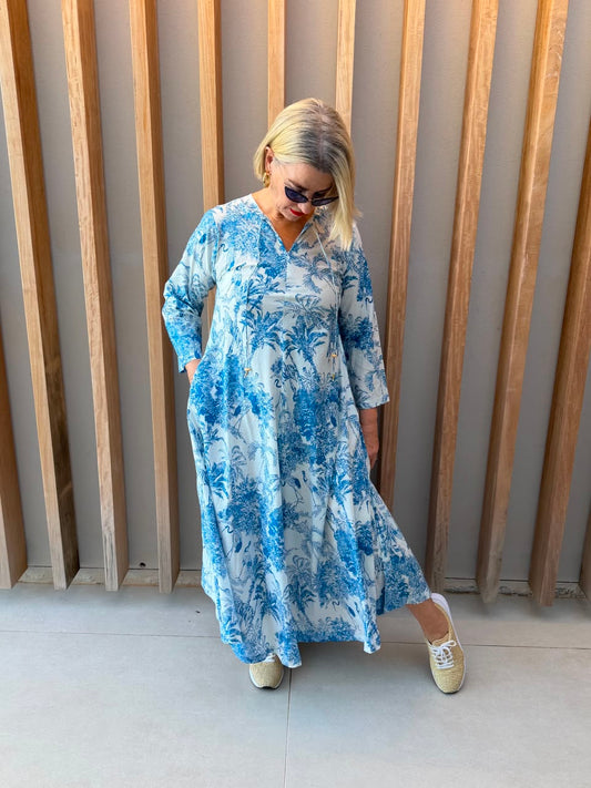 White dress with blue animal palm pattern