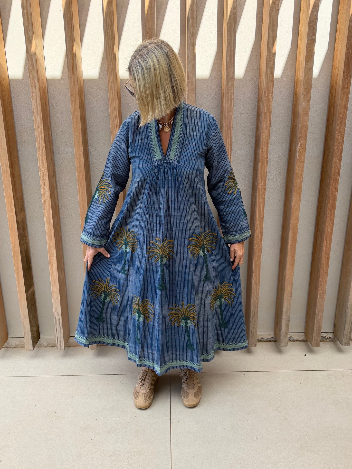 Blue dress with embroidered bronze palm