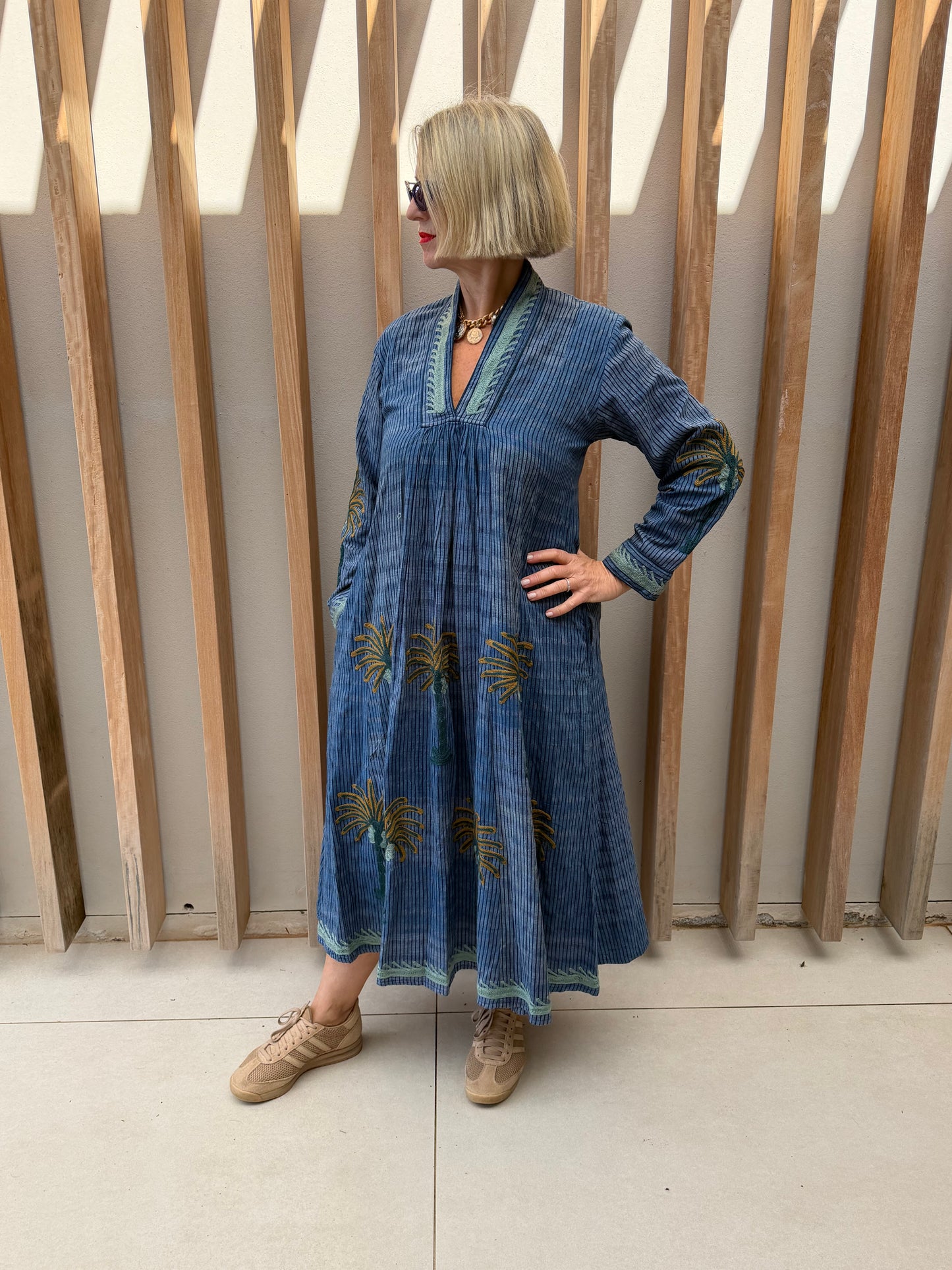 Blue dress with embroidered bronze palm