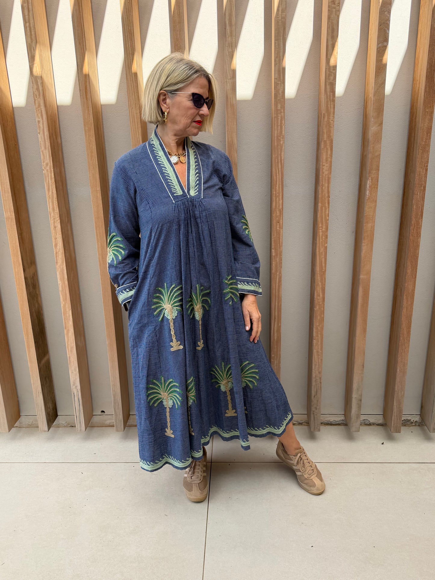 Blue dress with embroidered bronze palm