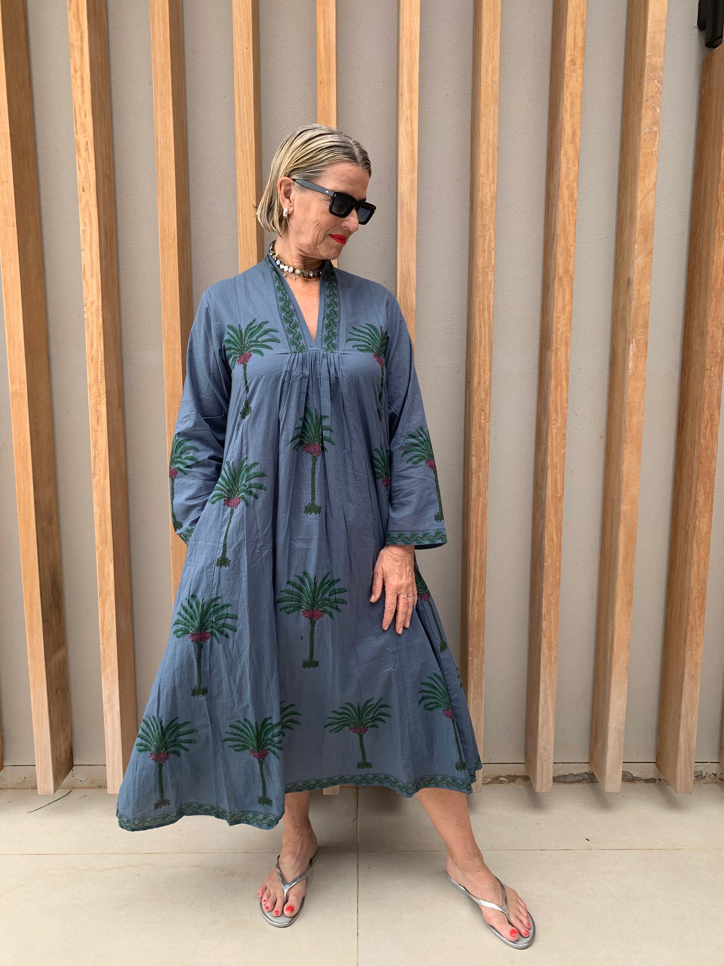 Blue dress with green palm floral pattern