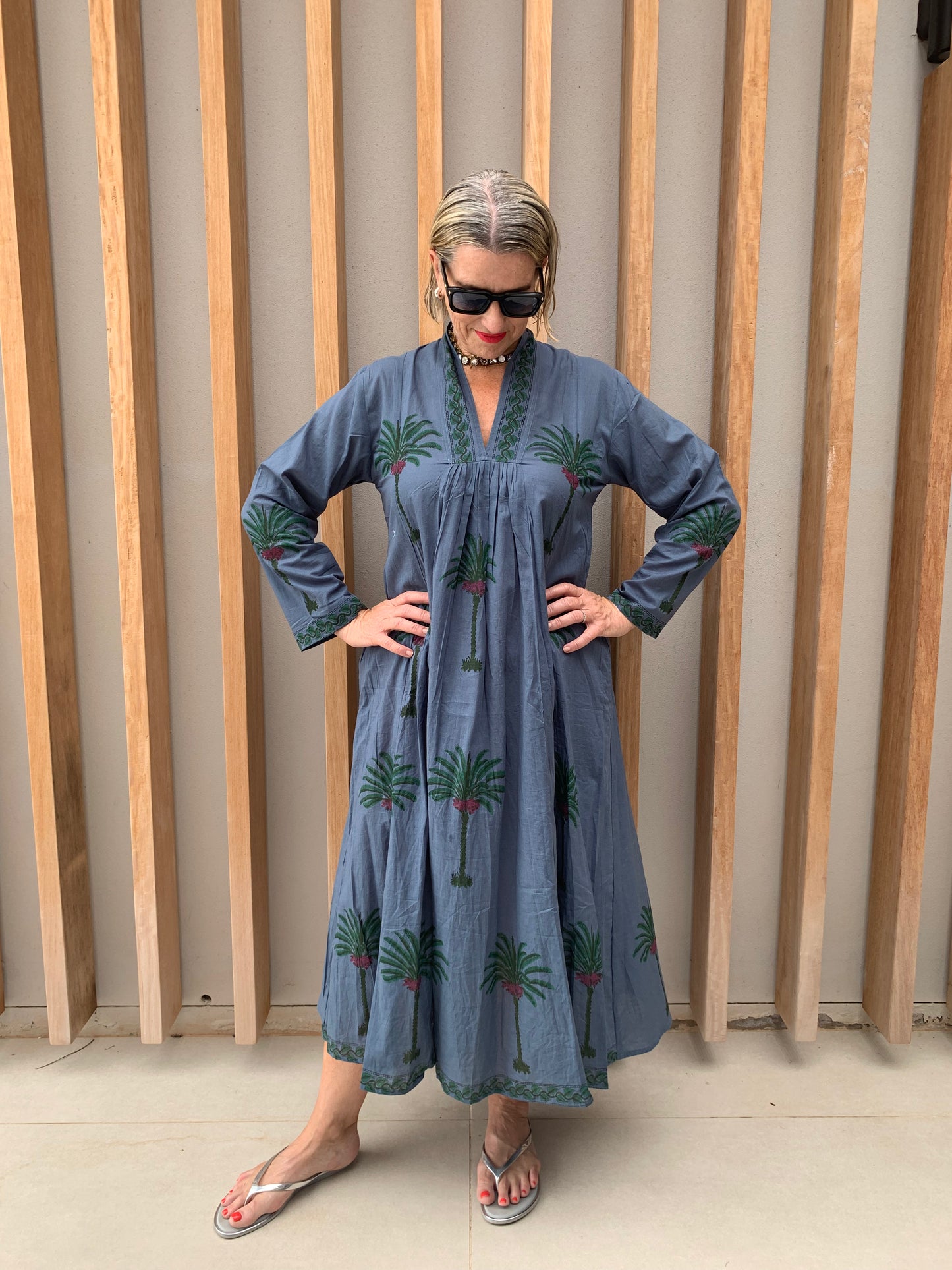 Blue dress with green palm floral pattern