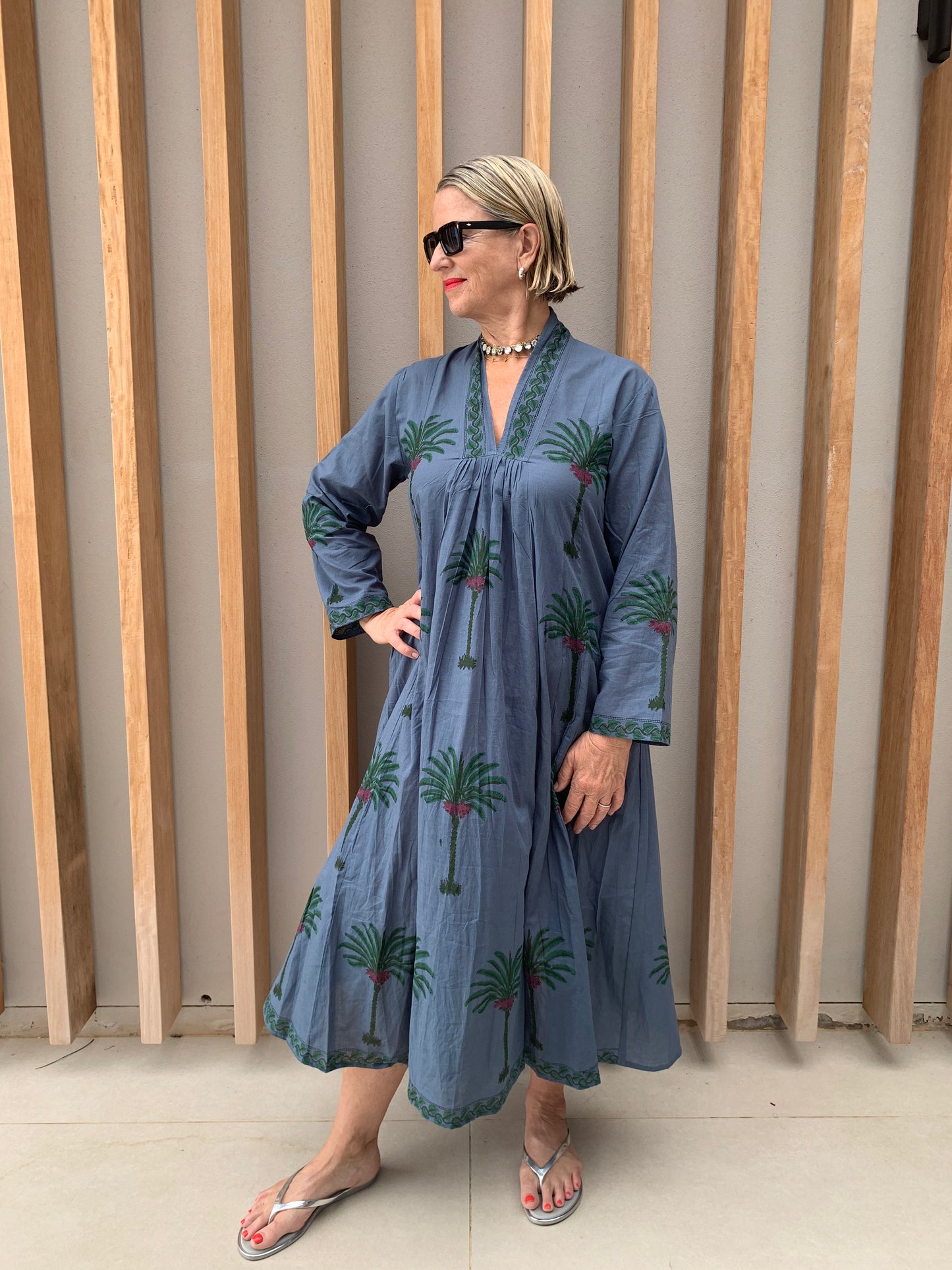 Blue dress with green palm floral pattern