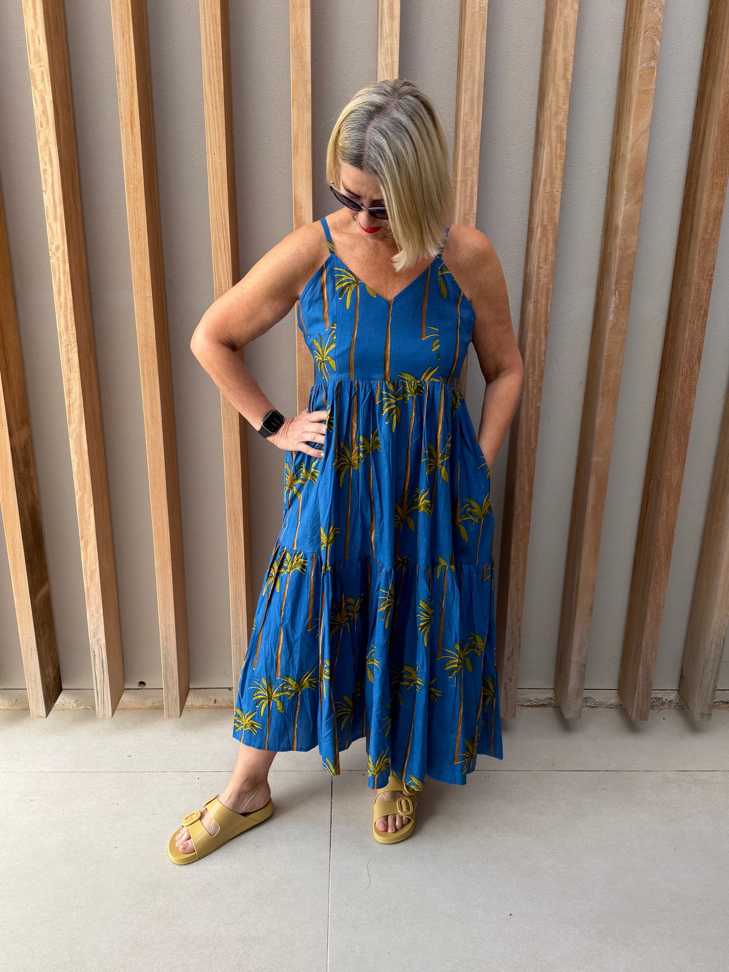 Blue sleeveless dress with palm pattern