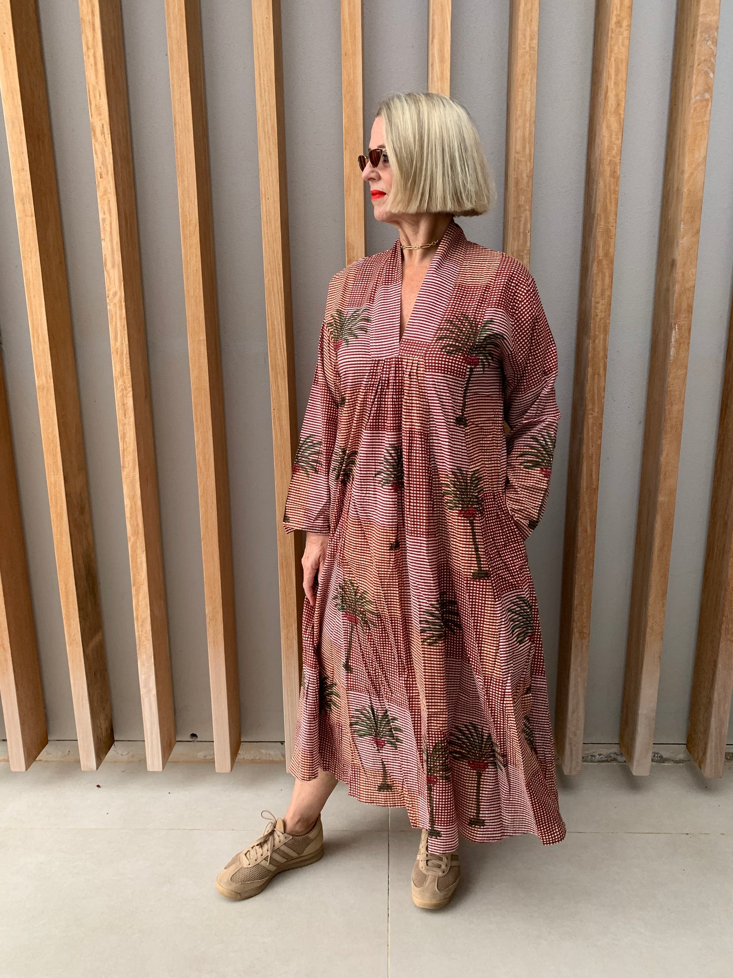 Orange & brick coloured fine checked dress with green palm pattern