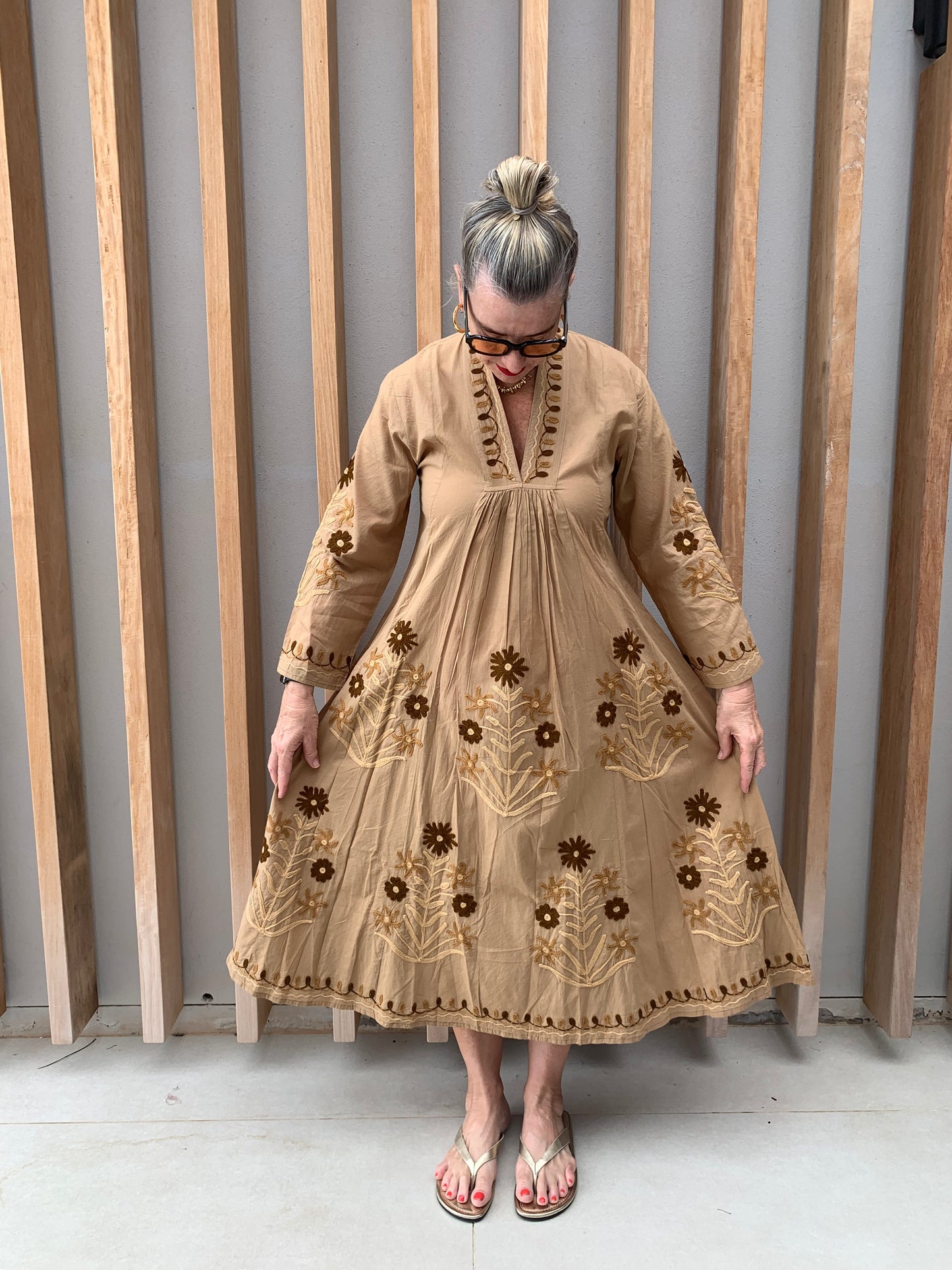 Caramel coloured dress with embroidered brown daisies