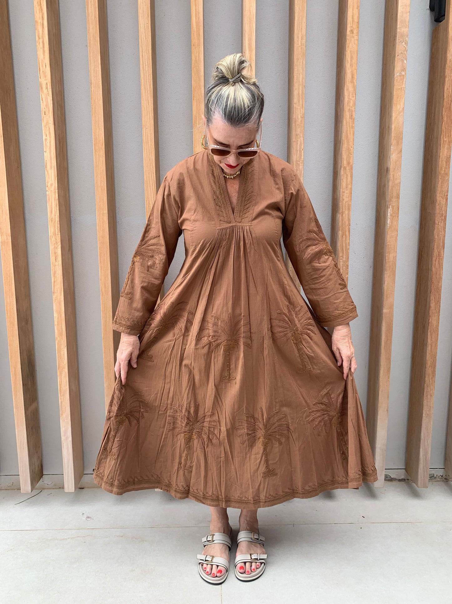 Caramel dress with embroidered palm pattern
