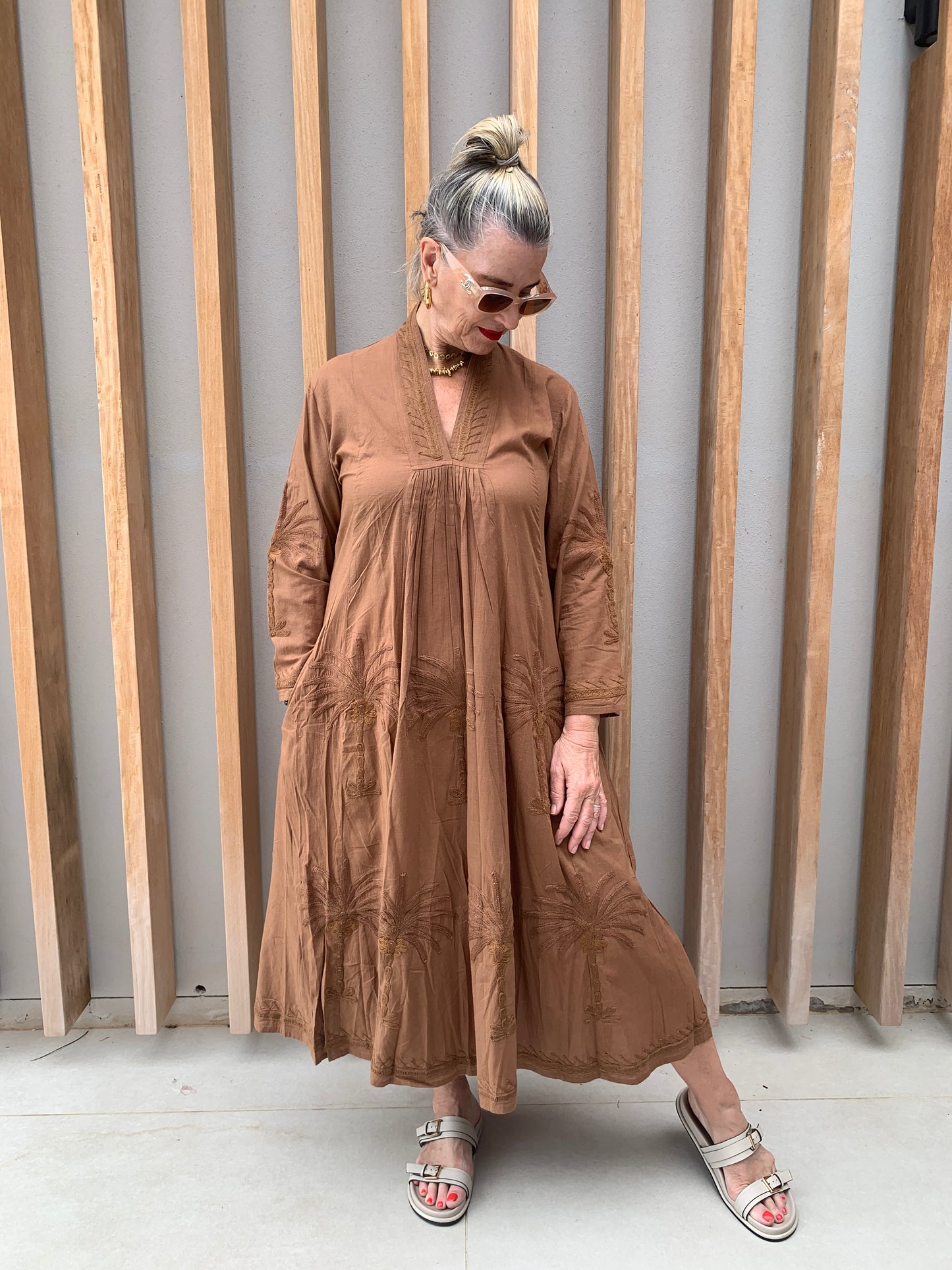Caramel dress with embroidered palm pattern