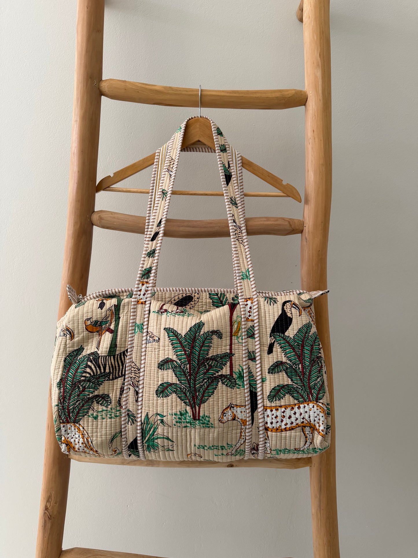Cream Duffle Bag with animal palm pattern