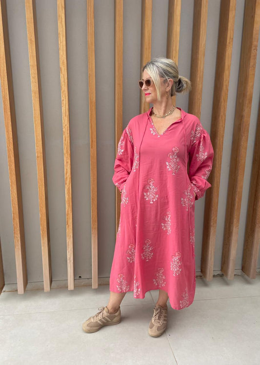 Deep pink dress with white floral pattern