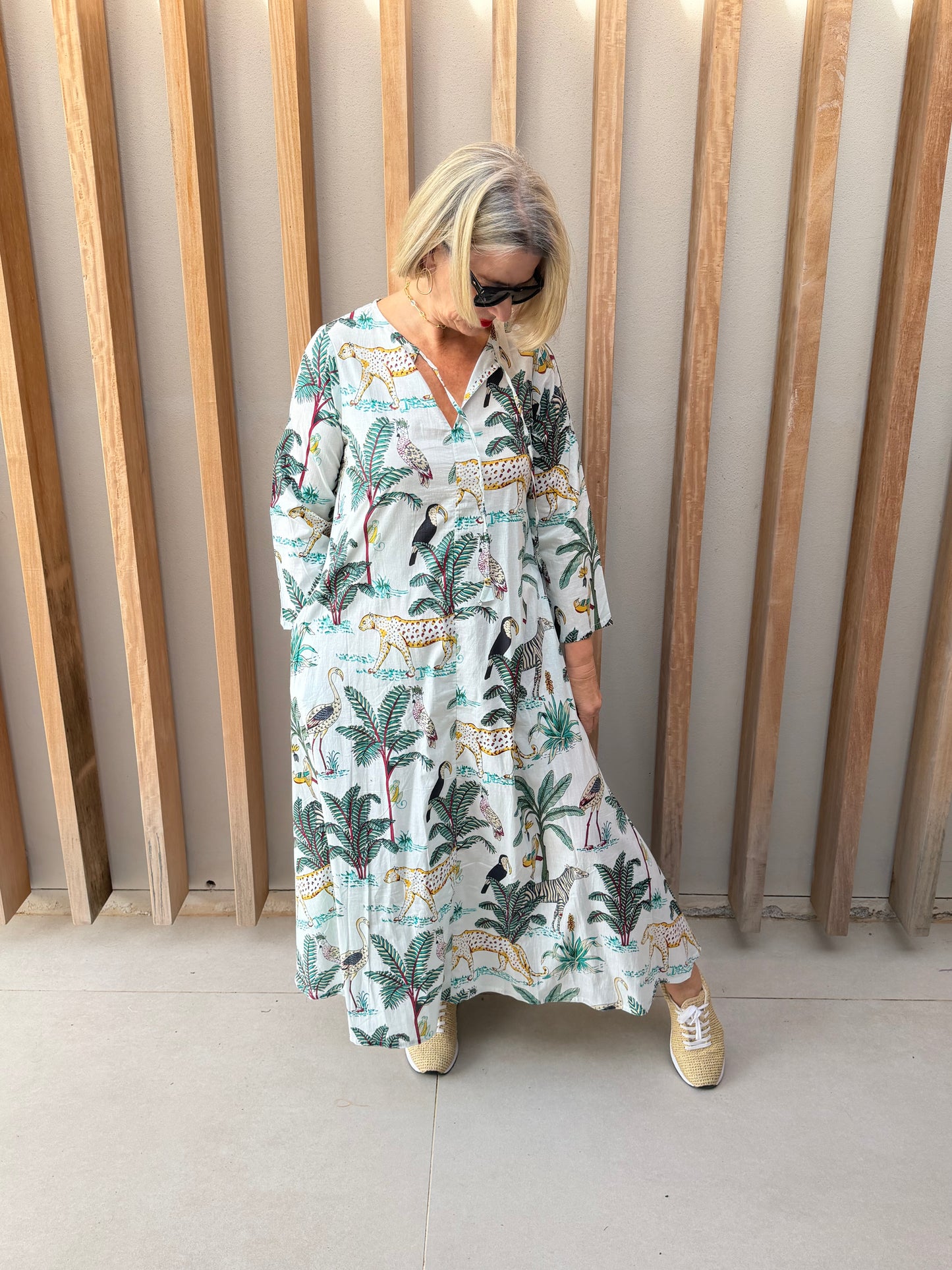 White dress with green animal fan palm